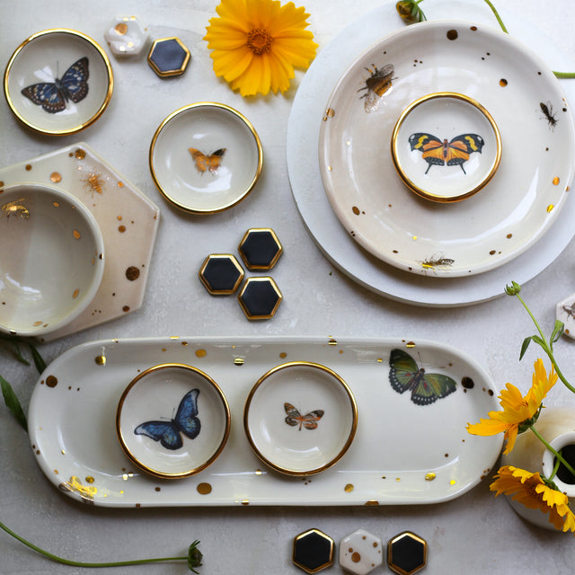 A collection of butterfly and bee pottery from Apricity ceramics